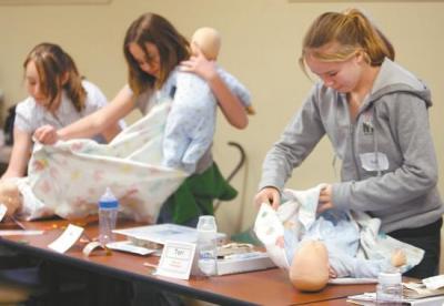 Girls Learning How to Babysit