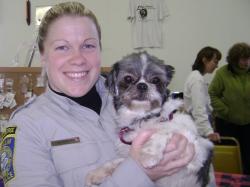 Officer Allison Caprigno Holding Small Dog