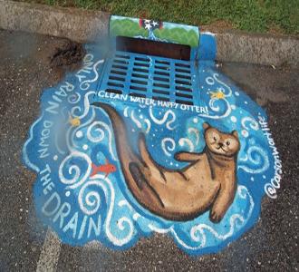 Water drain with mural of otter