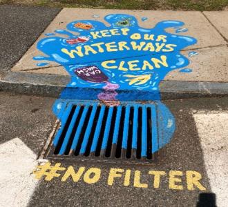 stormwater drain with caption of Keep our waterways clean